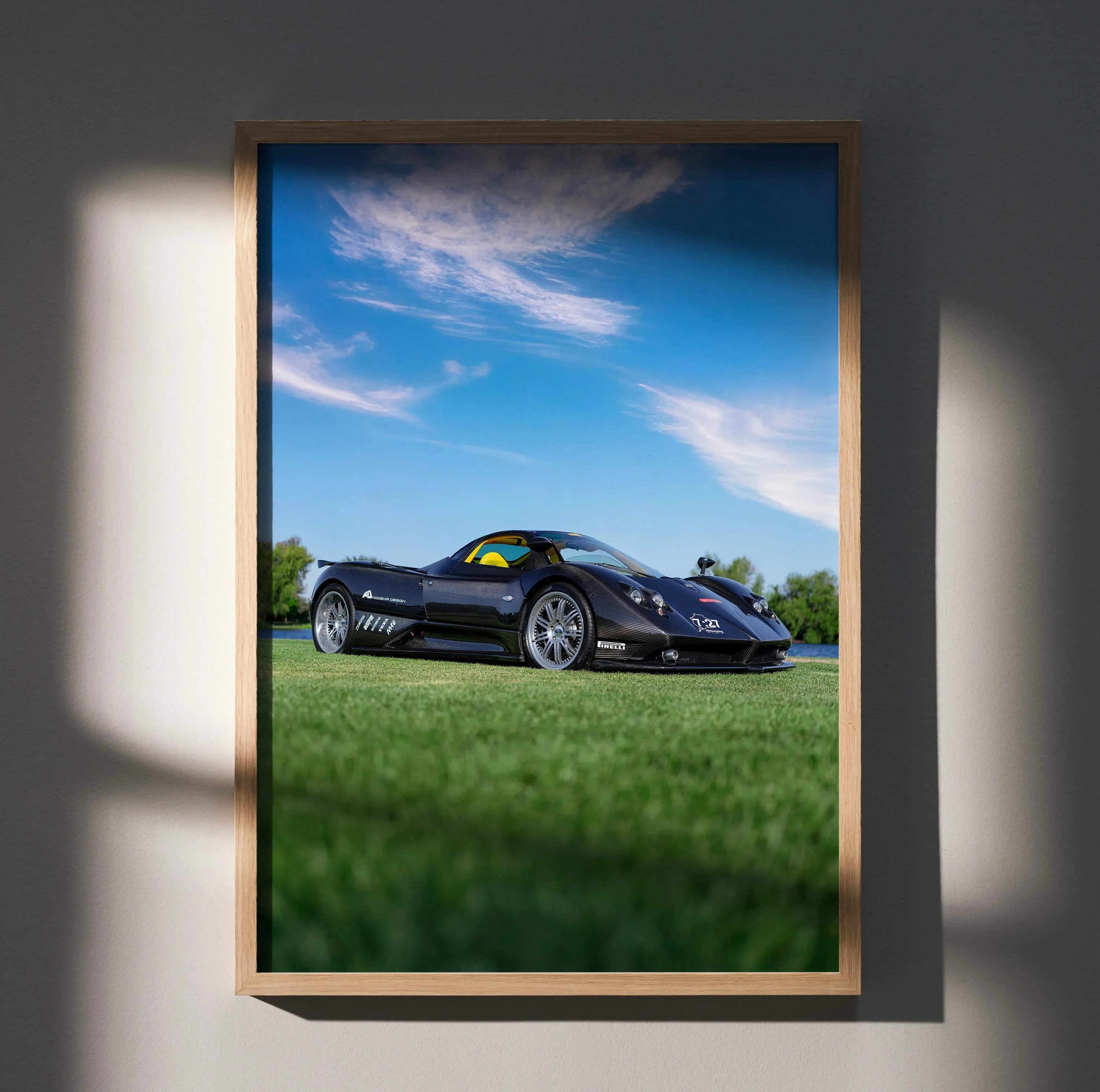 Pagani Zonda F Clubsport black sports car on grass with blue sky poster wall art.