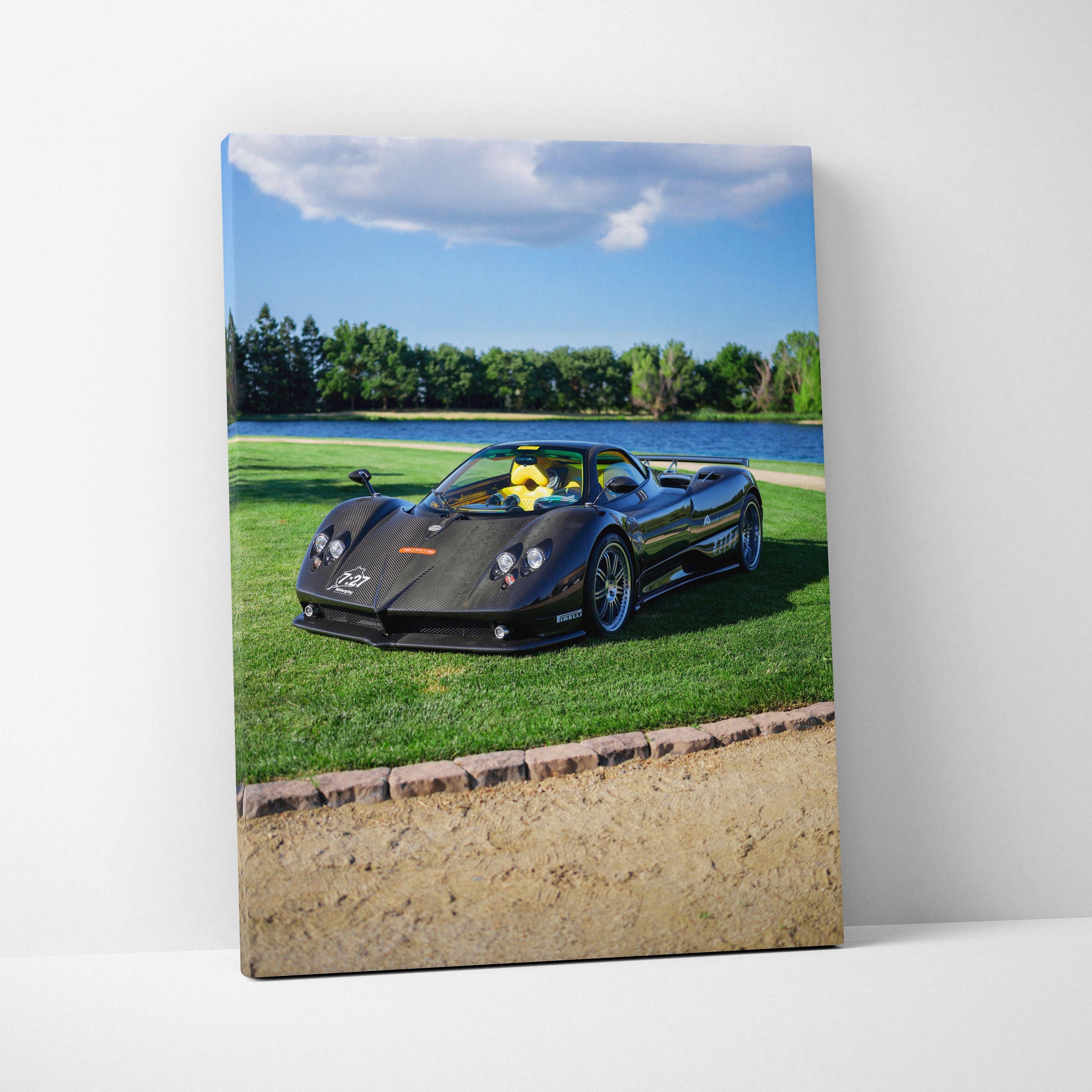 Pagani Zonda F Clubsport black sports car on green grass canvas wall art vertical print.