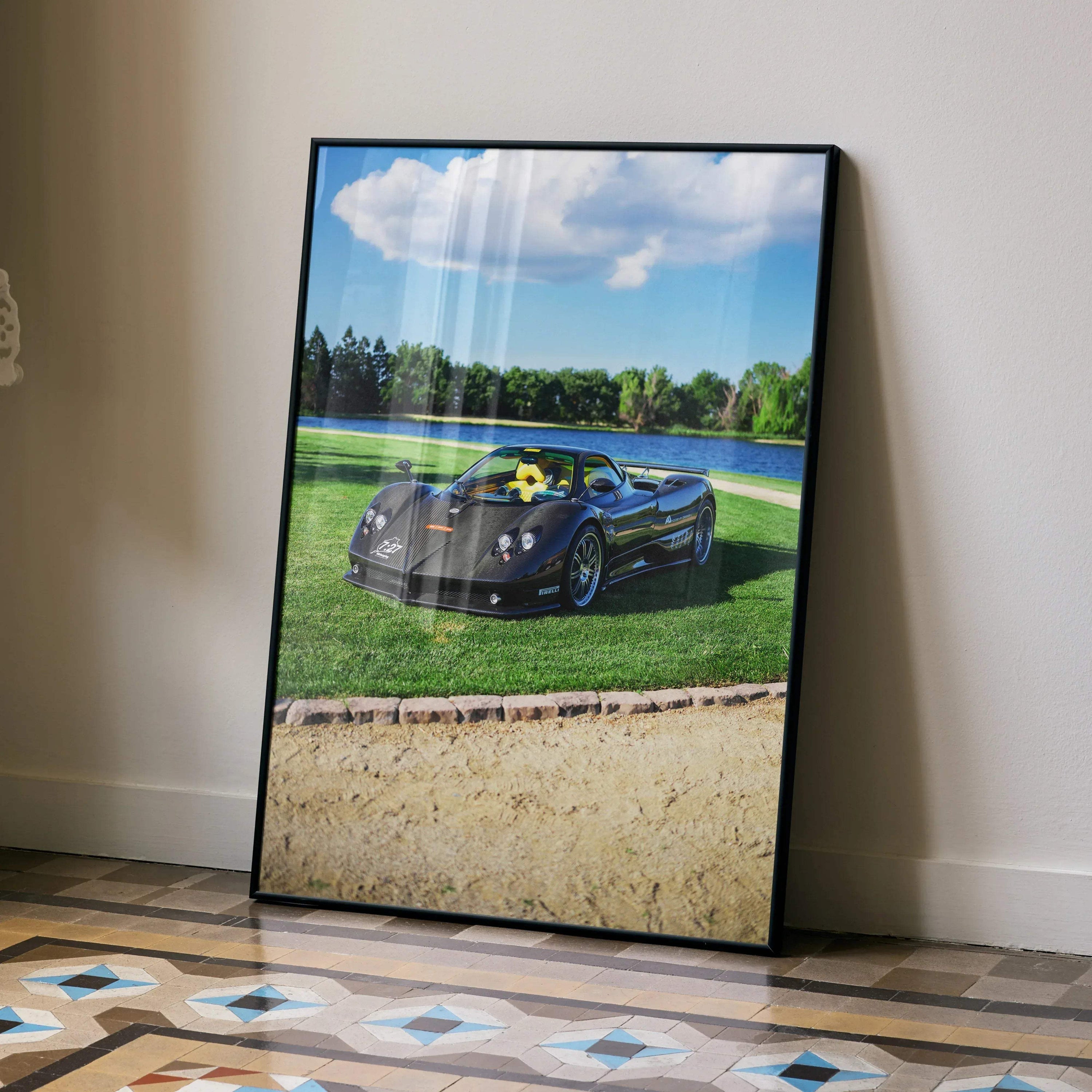 Pagani Zonda F Clubsport car poster with blue sky and green grass wall art in black frame.