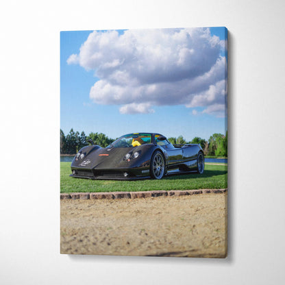 Pagani Zonda F Clubsport black sports car on green grass under blue sky canvas wall art.