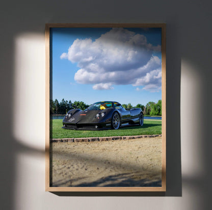 Pagani Zonda F Clubsport black sports car on racetrack poster wall art in wooden frame.