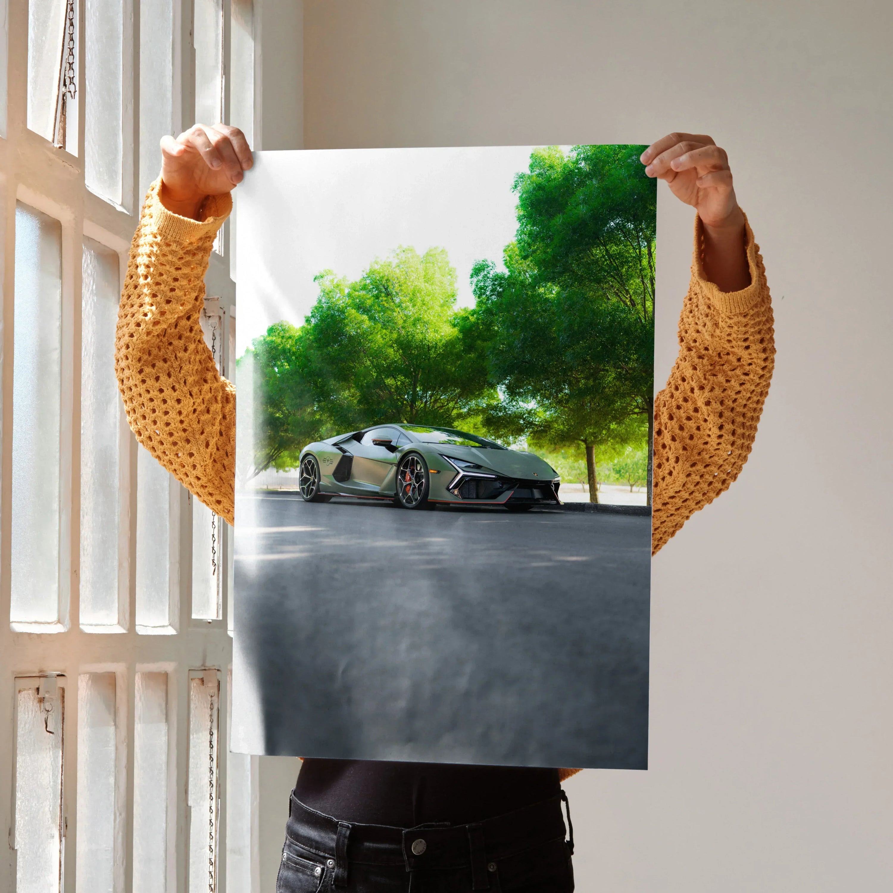 Lamborghini Revuelto sports car parked under green trees street scene poster wall art.