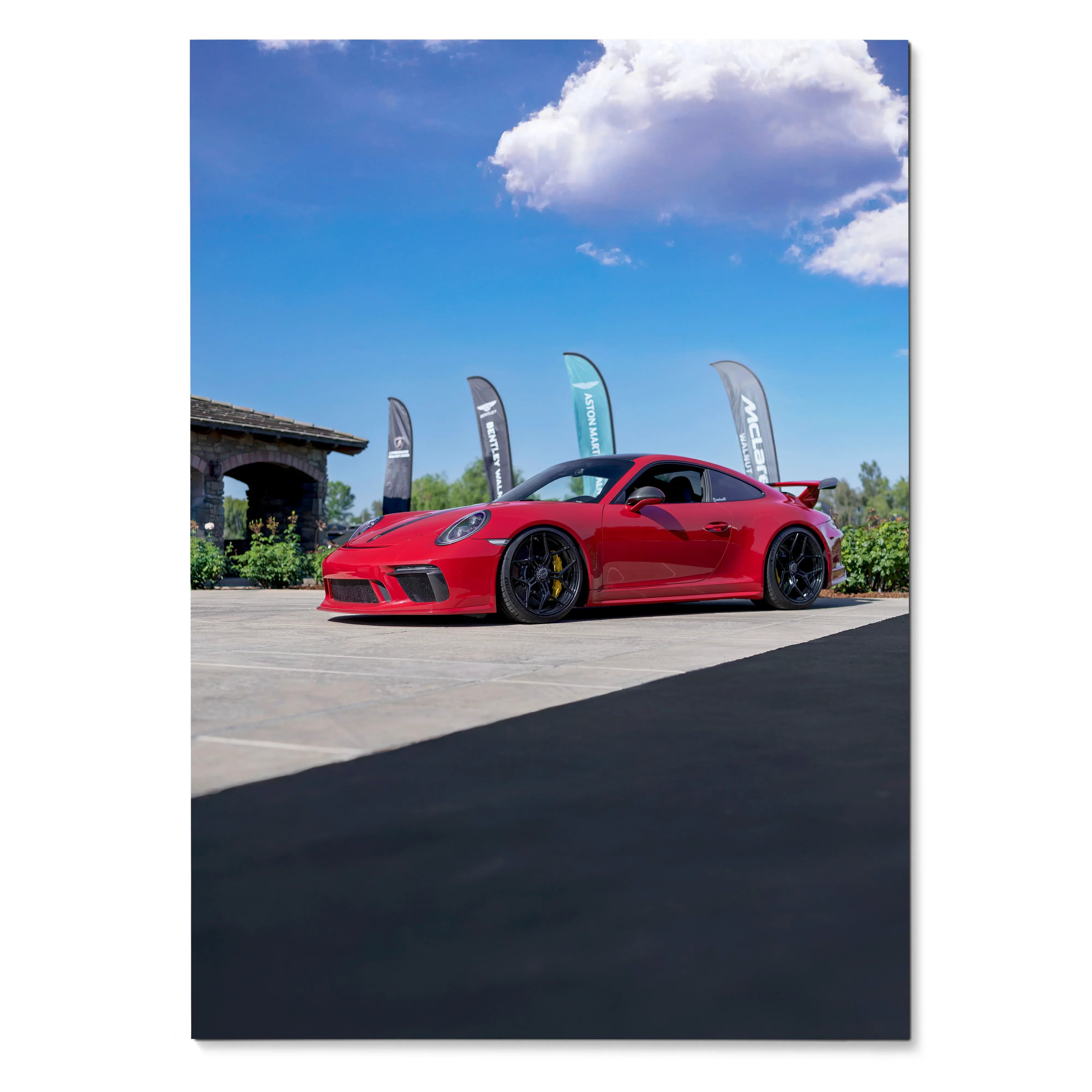 Red Porsche 911 GT3 parked outdoors under blue sky, glossy sports car poster wall art.