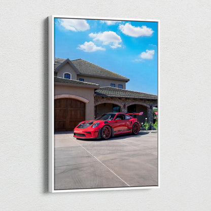 Red Porsche 911 GT3 RS parked in driveway with blue sky vertical canvas wall art.
