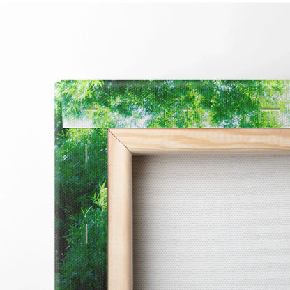 Vertical canvas wall art with green abstract brush strokes and natural wood frame.