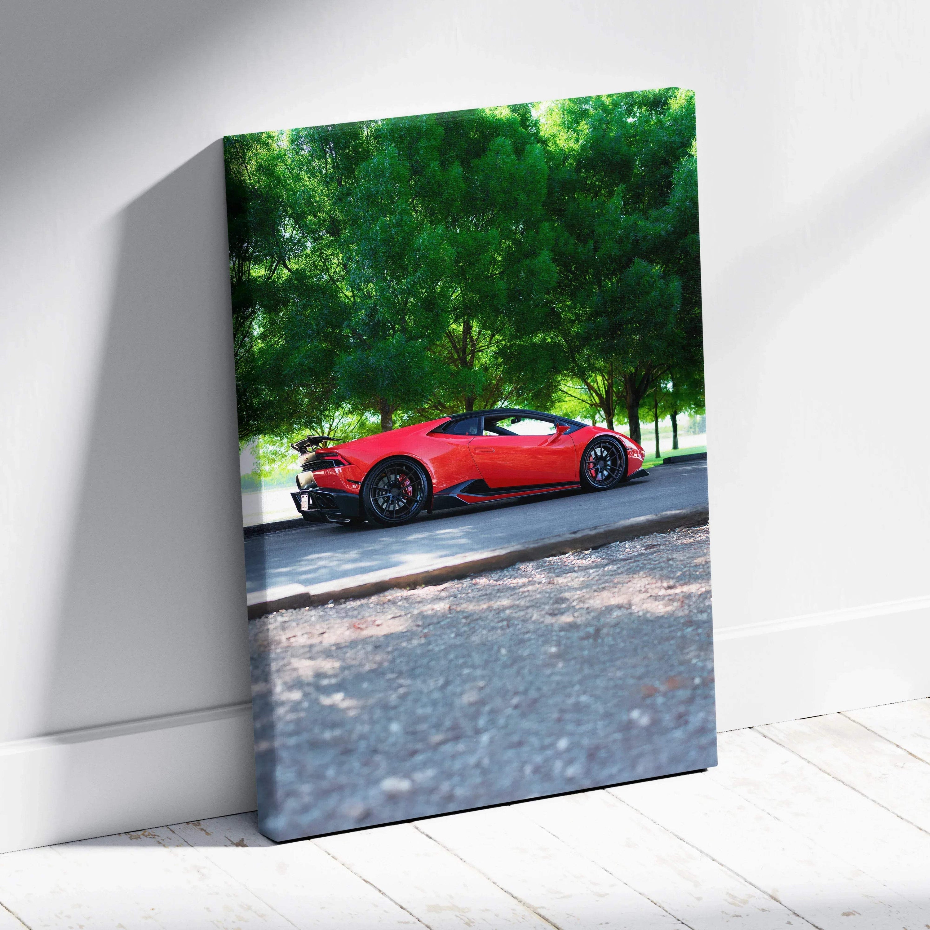 Red Lamborghini Huracan convertible parked under green trees on vertical canvas wall art.