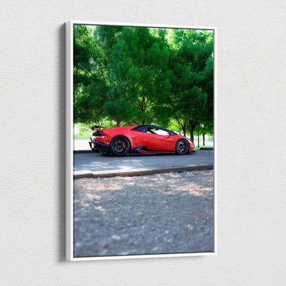 Vertical canvas art of red Lamborghini Huracan parked on road with green trees background.