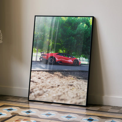 Lamborghini Huracan red sports car poster leaning against wall with tree background wall art.