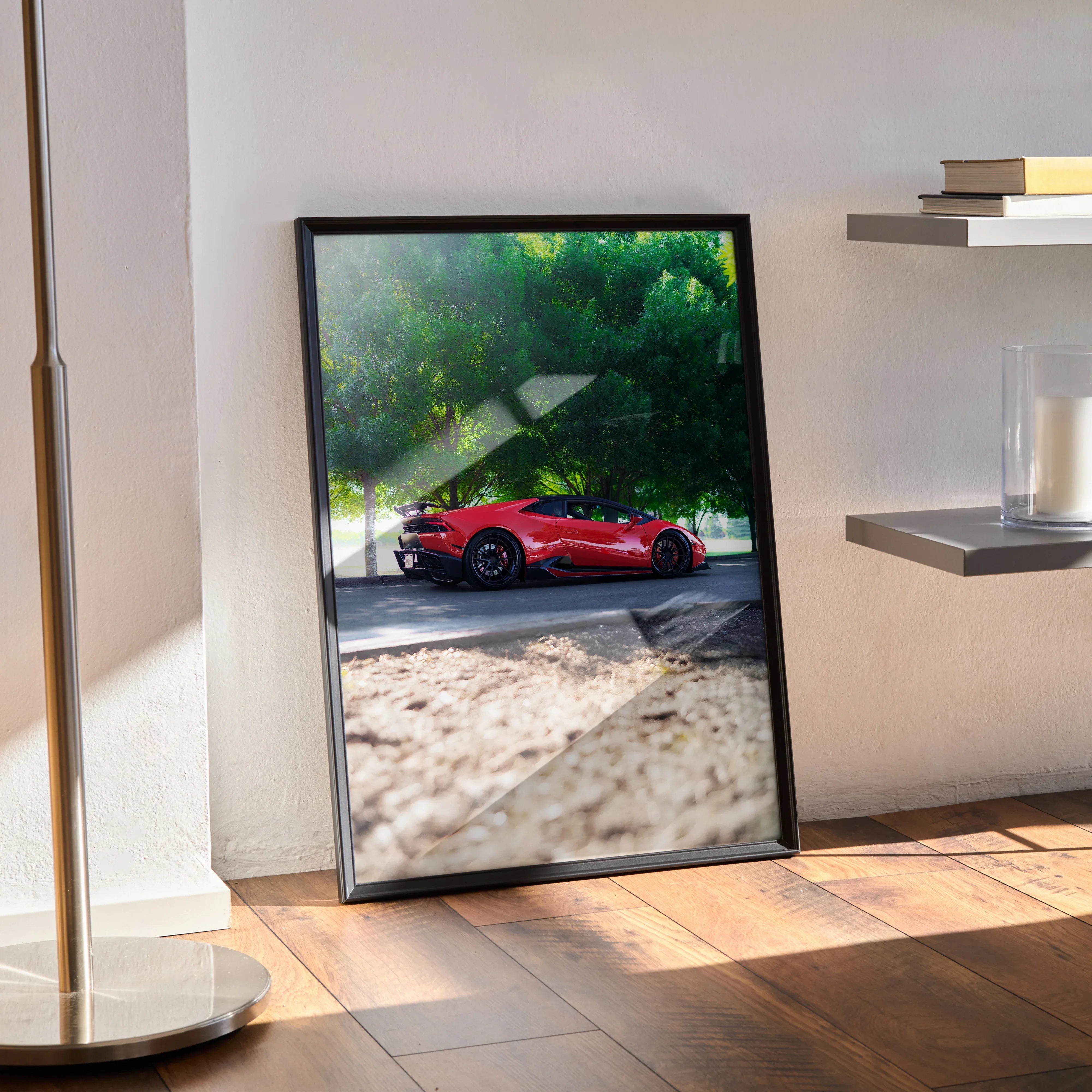 Lamborghini Huracan red sports car poster leaning against wall, modern wall art in black frame.