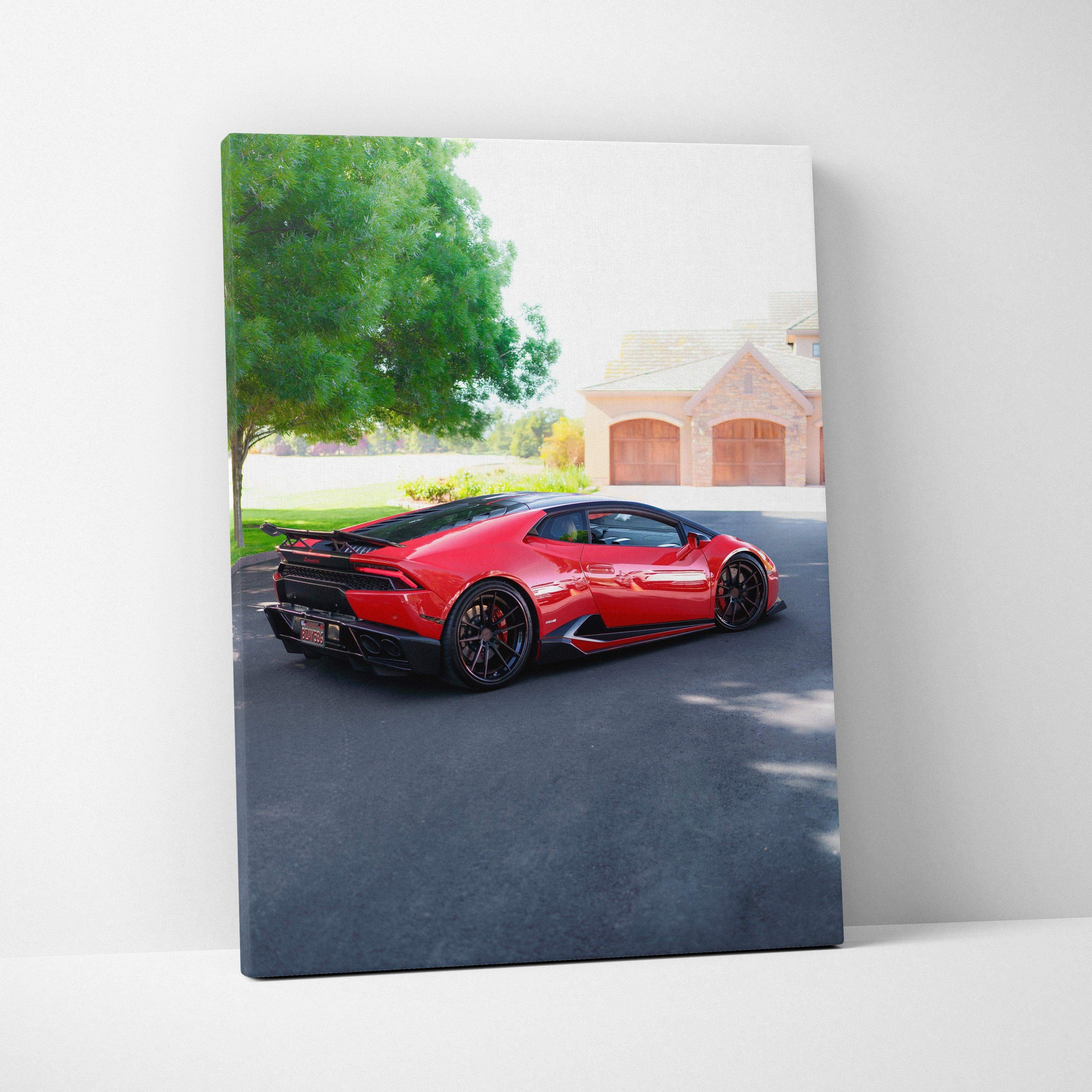 Vertical canvas wall art featuring a red Lamborghini Huracan parked on a driveway with trees and a house in the background.