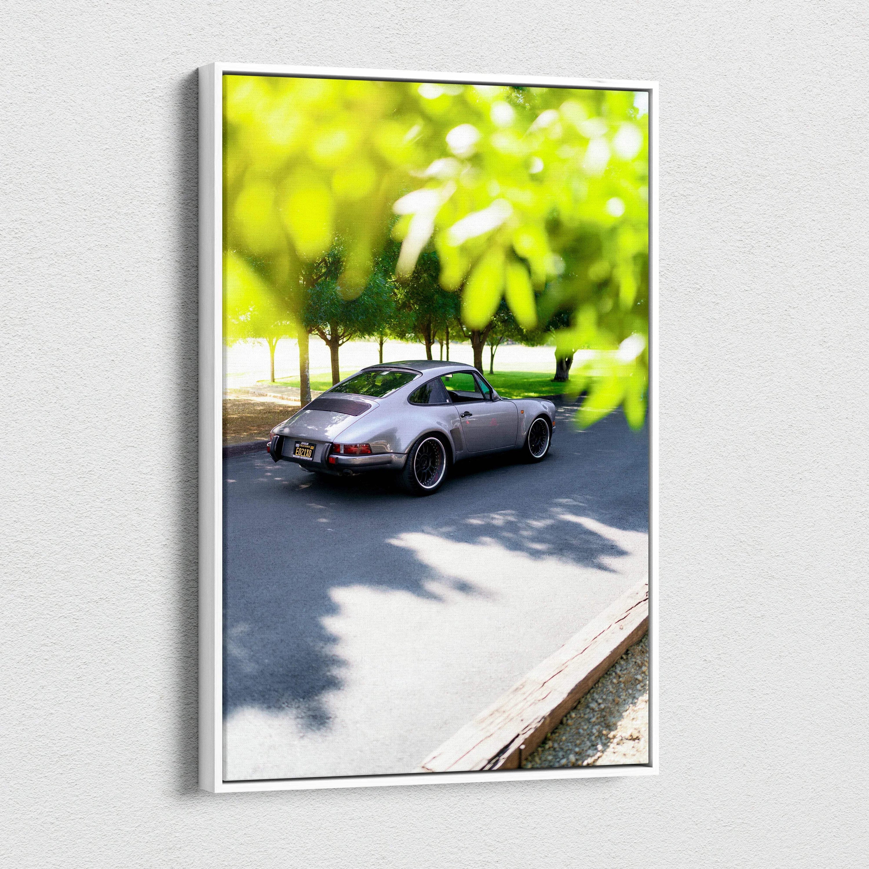 Porsche 911 classic car parked on road with green leaves foreground vertical canvas art wall decor.