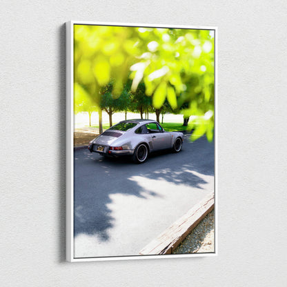 Porsche 911 classic car parked on road with green leaves foreground vertical canvas art wall decor.