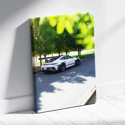 Vertical canvas art of white Porsche 911 GT3 RS parked under green trees, museum-quality wall art.