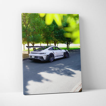 Porsche 911 GT3 RS parked outdoors with trees in background vertical canvas wall art.