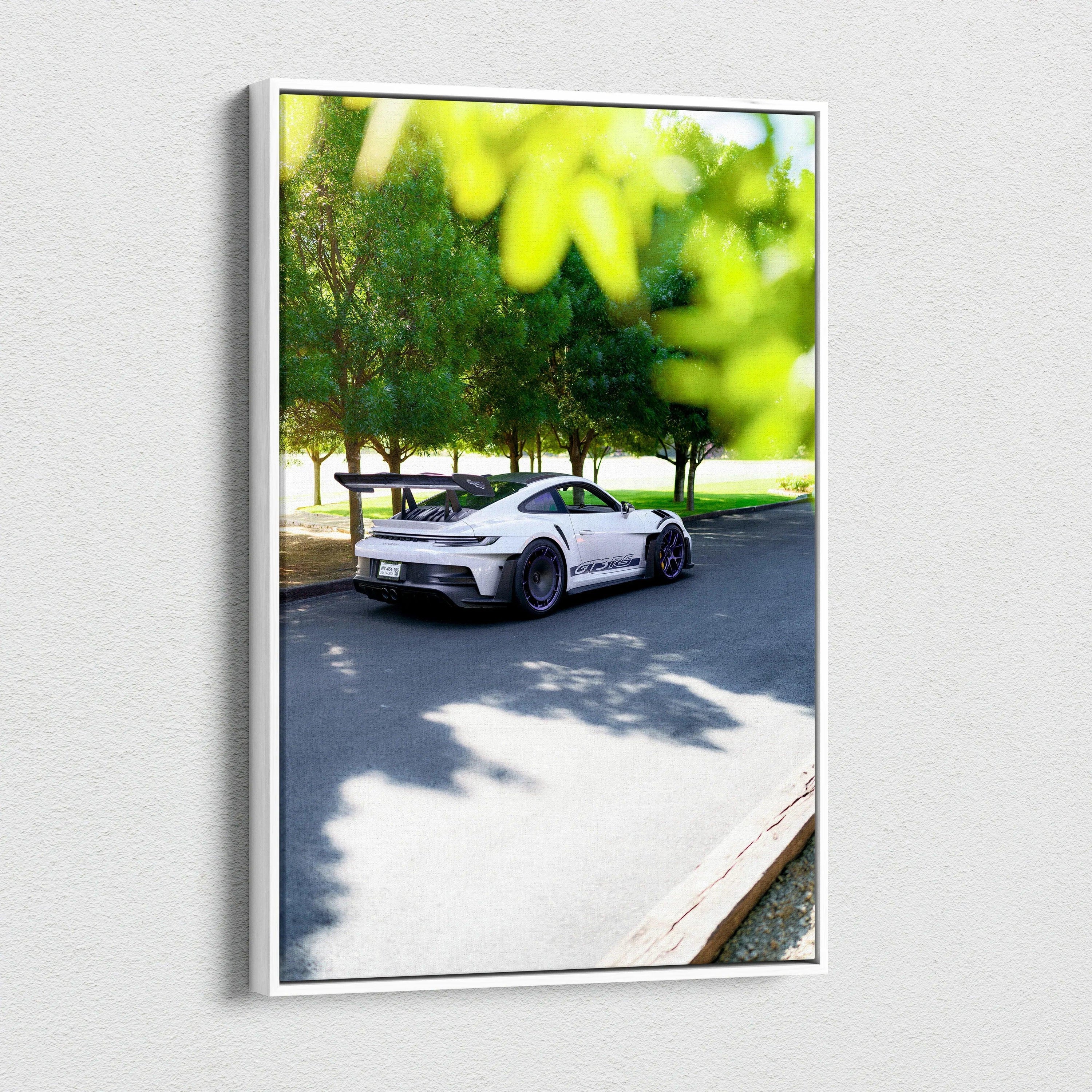 Vertical canvas art featuring a white Porsche 911 GT3 RS parked by trees, vibrant wall art.