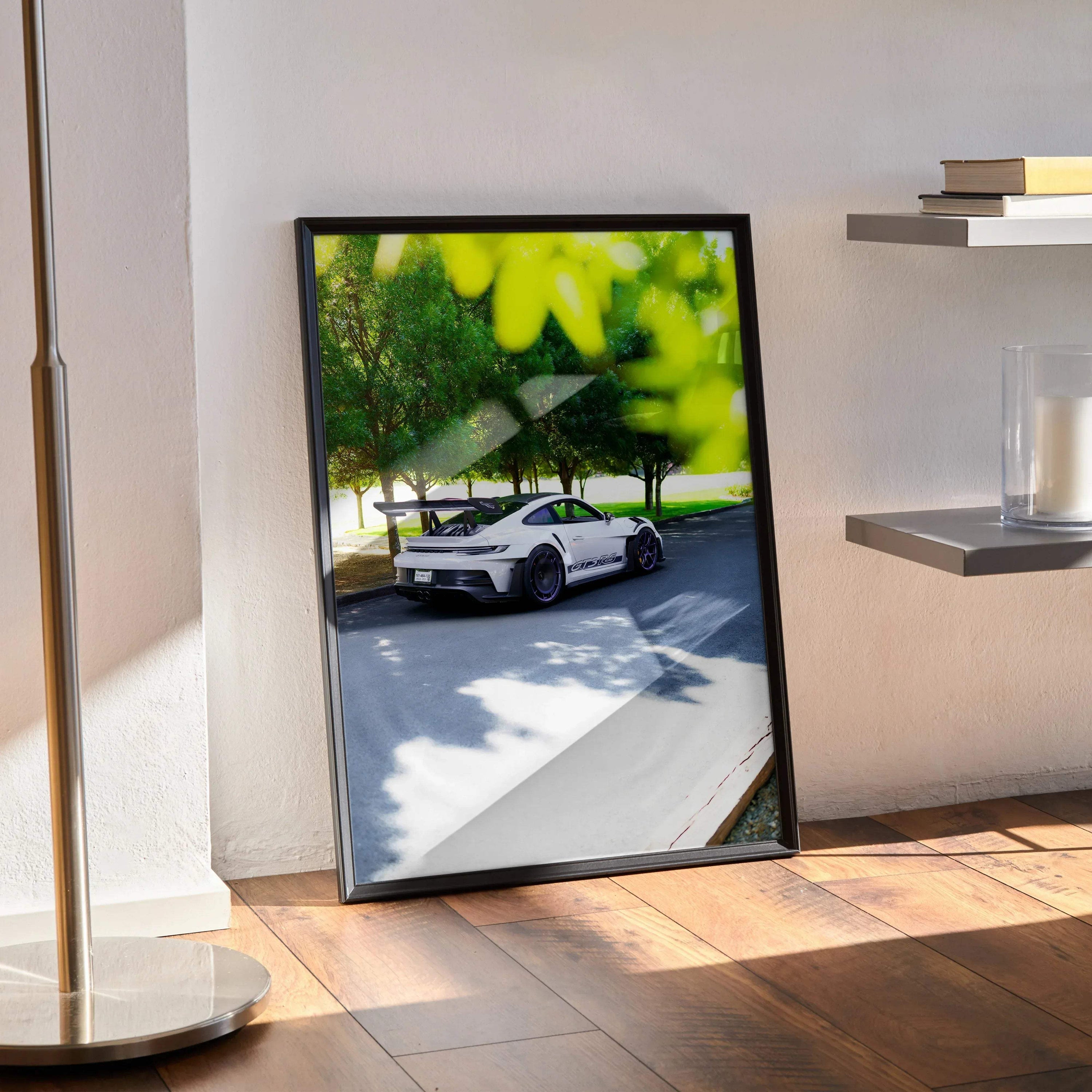 Porsche 911 GT3 RS driving on a sunny road framed as stylish poster wall art.