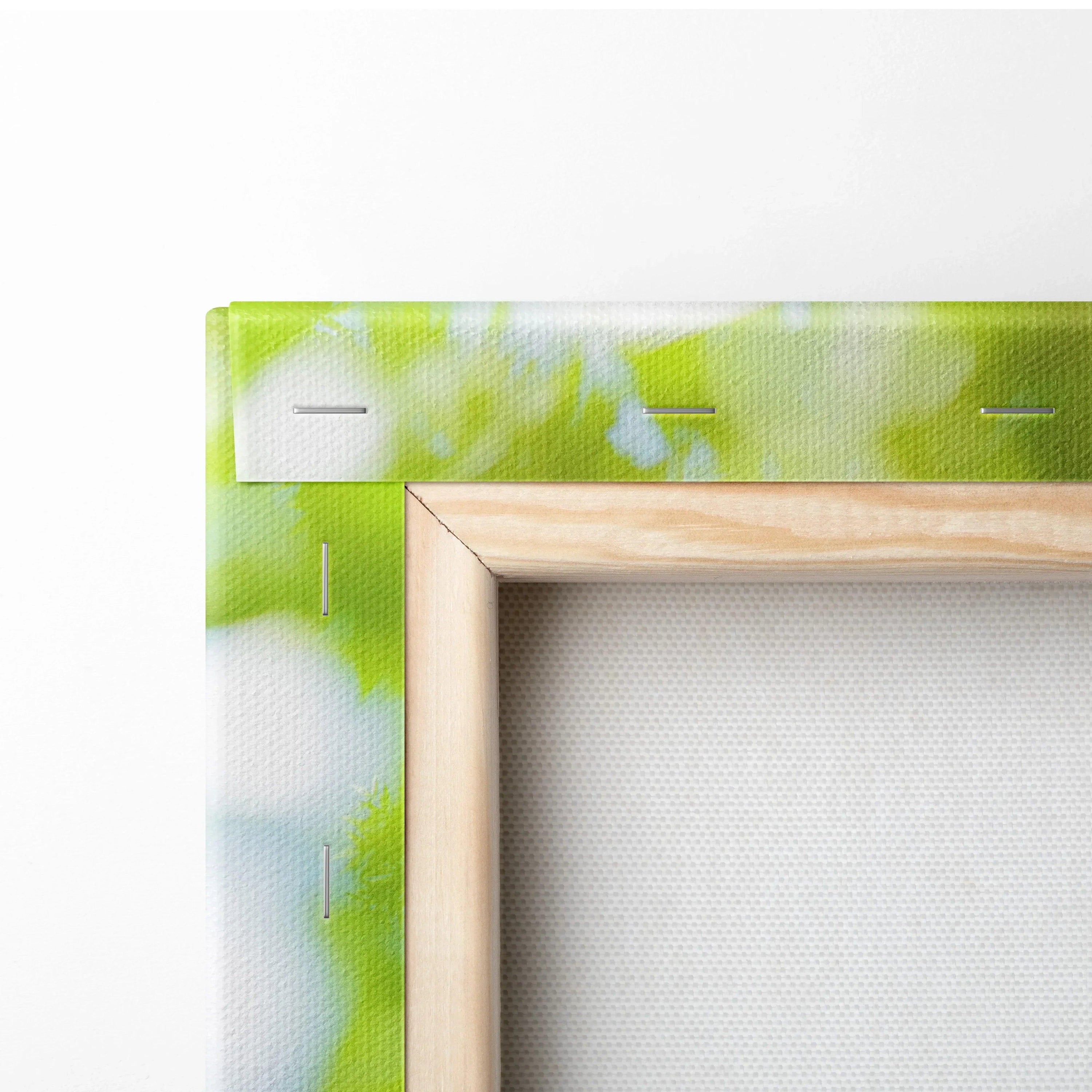 Close-up of a wooden frame corner with green and white fabric stretched for canvas wall art.