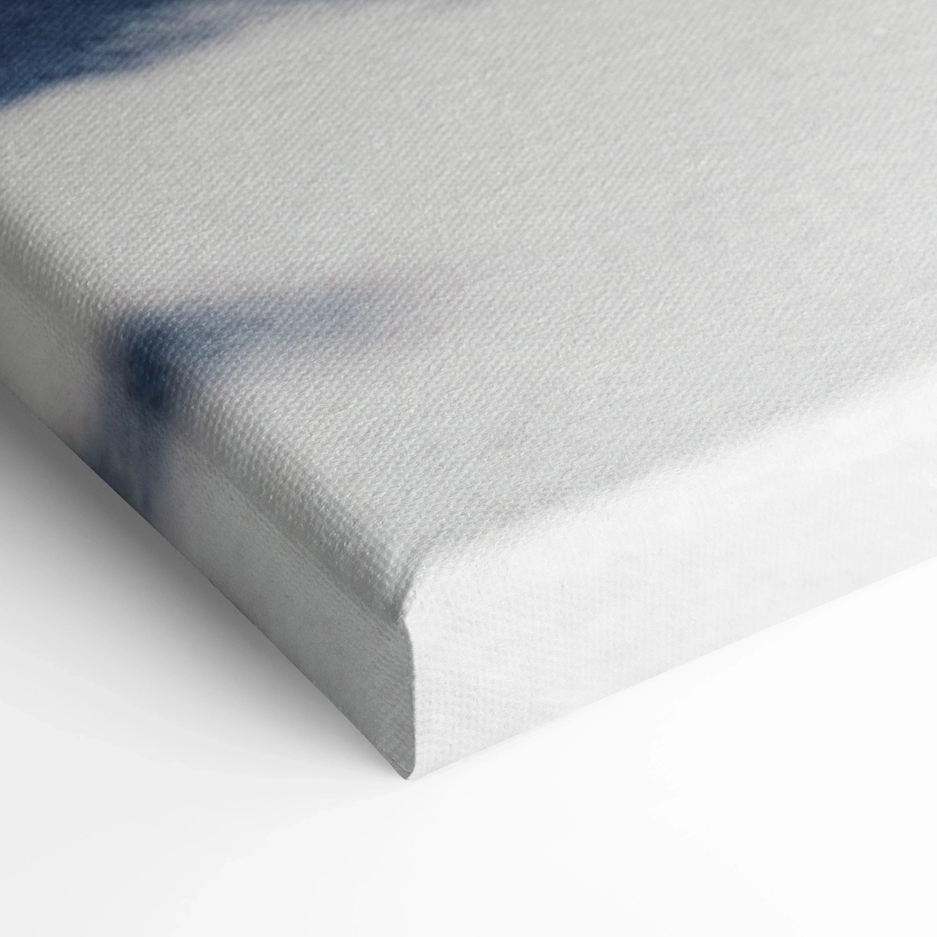 Close-up of white stretched canvas corner showing texture and edge of wall art canvas print.