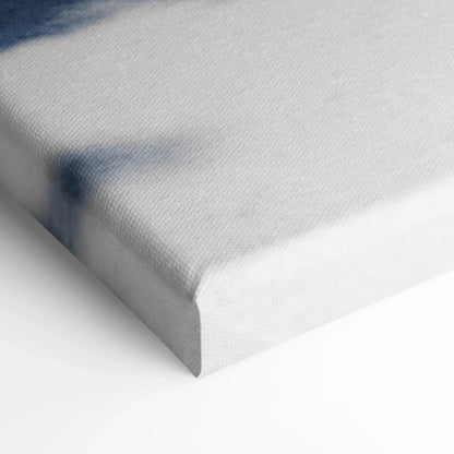 Close-up of white stretched canvas corner showing texture and edge of wall art canvas print.