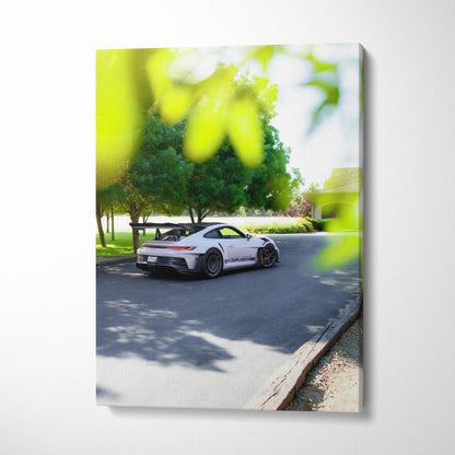 Vertical canvas art featuring a white Porsche 911 GT3 RS parked by trees in a sunlit outdoor setting.