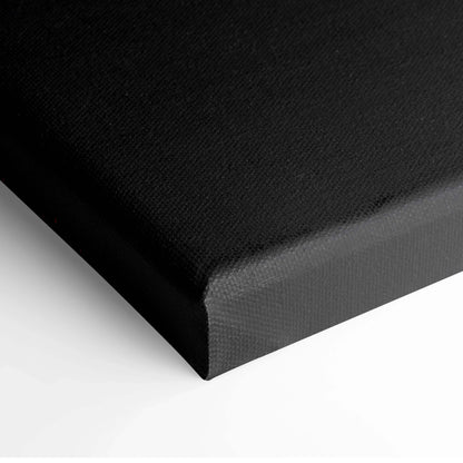 Black stretched canvas wall art with textured surface and clean wrapped edges.