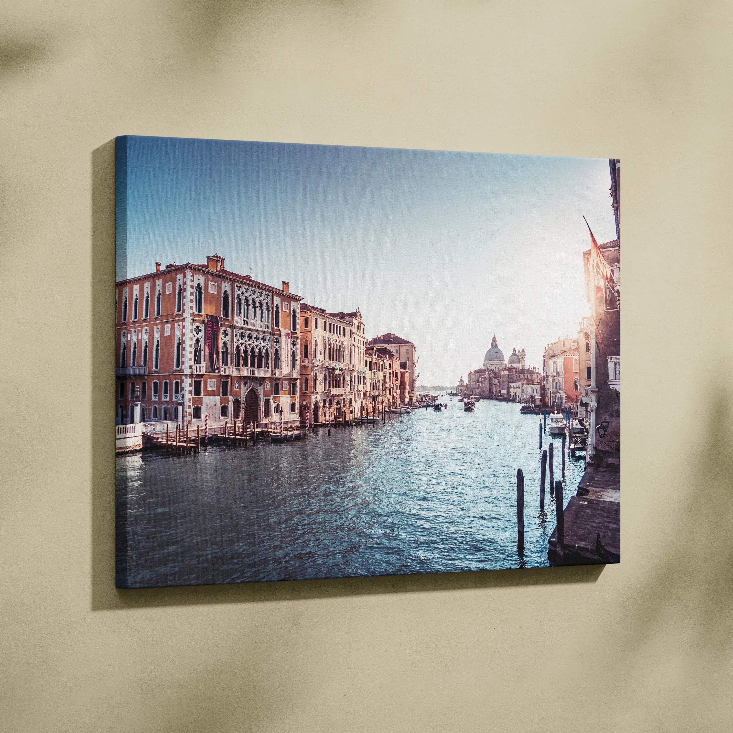 Canvas wall art depicting a serene Venetian canal with historic buildings under a clear blue sky.