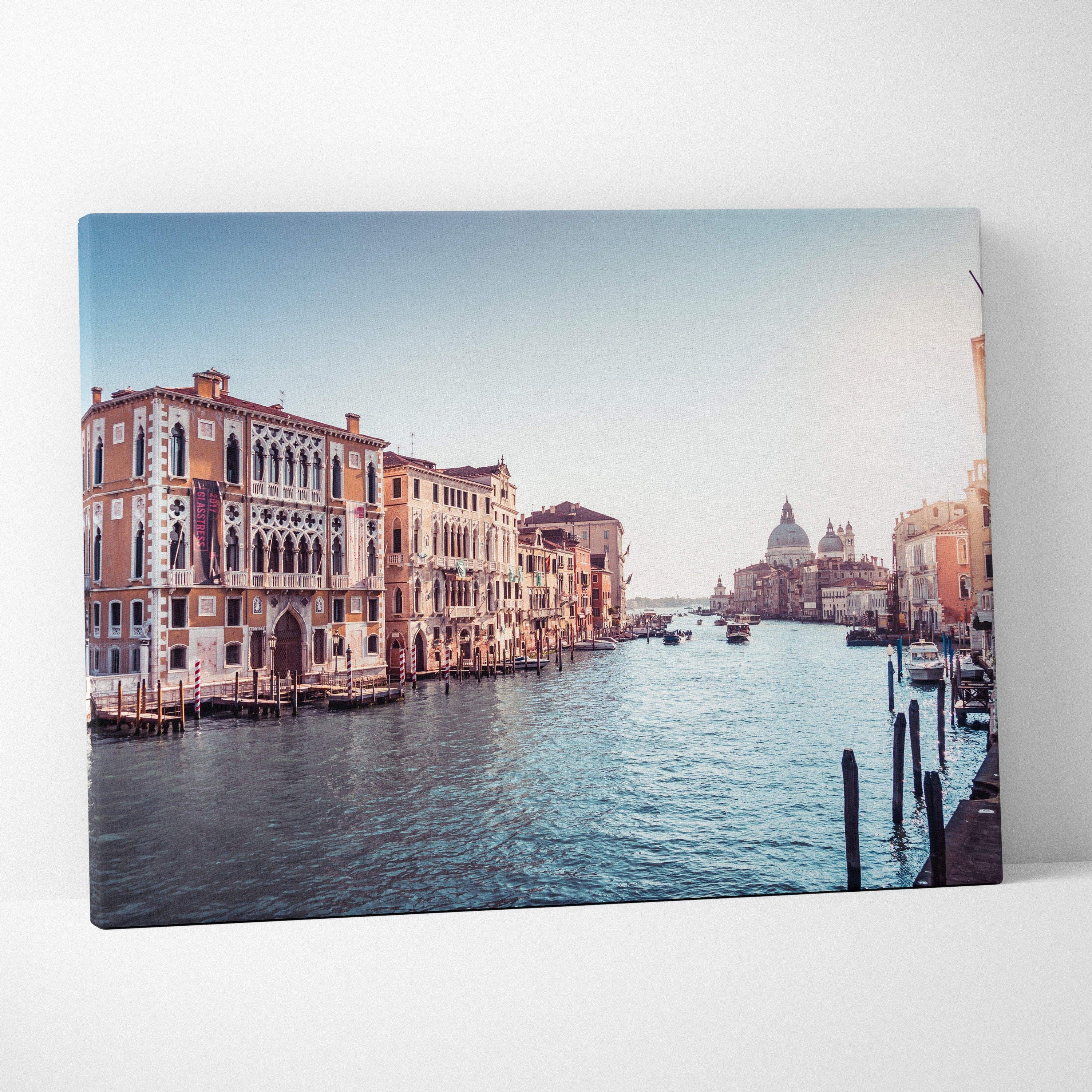 Canvas wall art featuring a serene Venice canal scene with historic buildings and soft blue sky.
