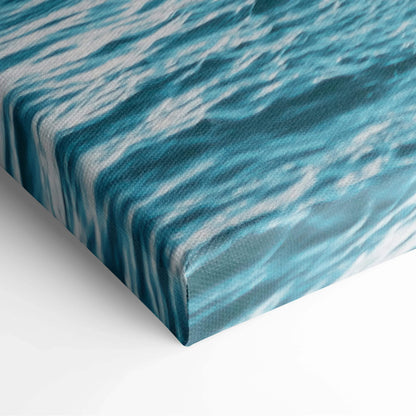 Canvas wall art print featuring abstract blue and white wave-like patterns with textured, wrapped edges.
