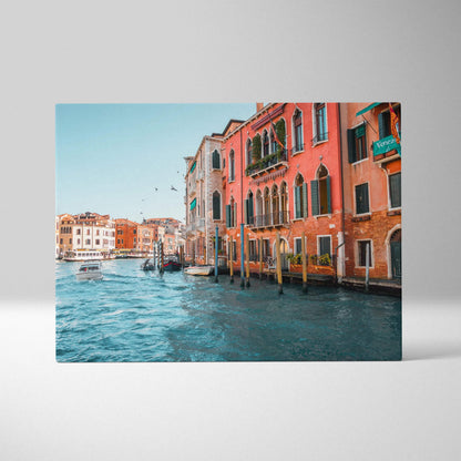Canvas wall art print of colorful Venetian buildings along a canal with blue water and clear sky.