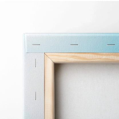 Close-up of wooden stretcher bar and stapled fabric backing on vertical canvas wall art panel.