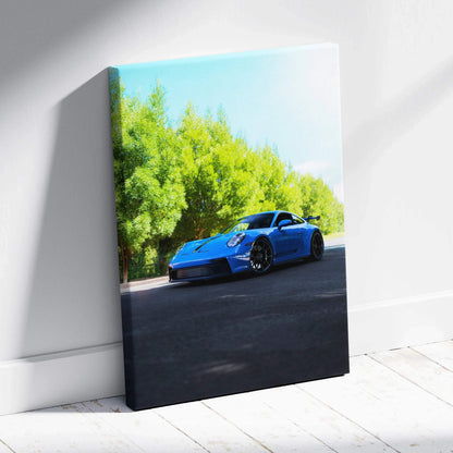 Blue Porsche 911 GT3 racing car on road with trees background vertical canvas wall art.