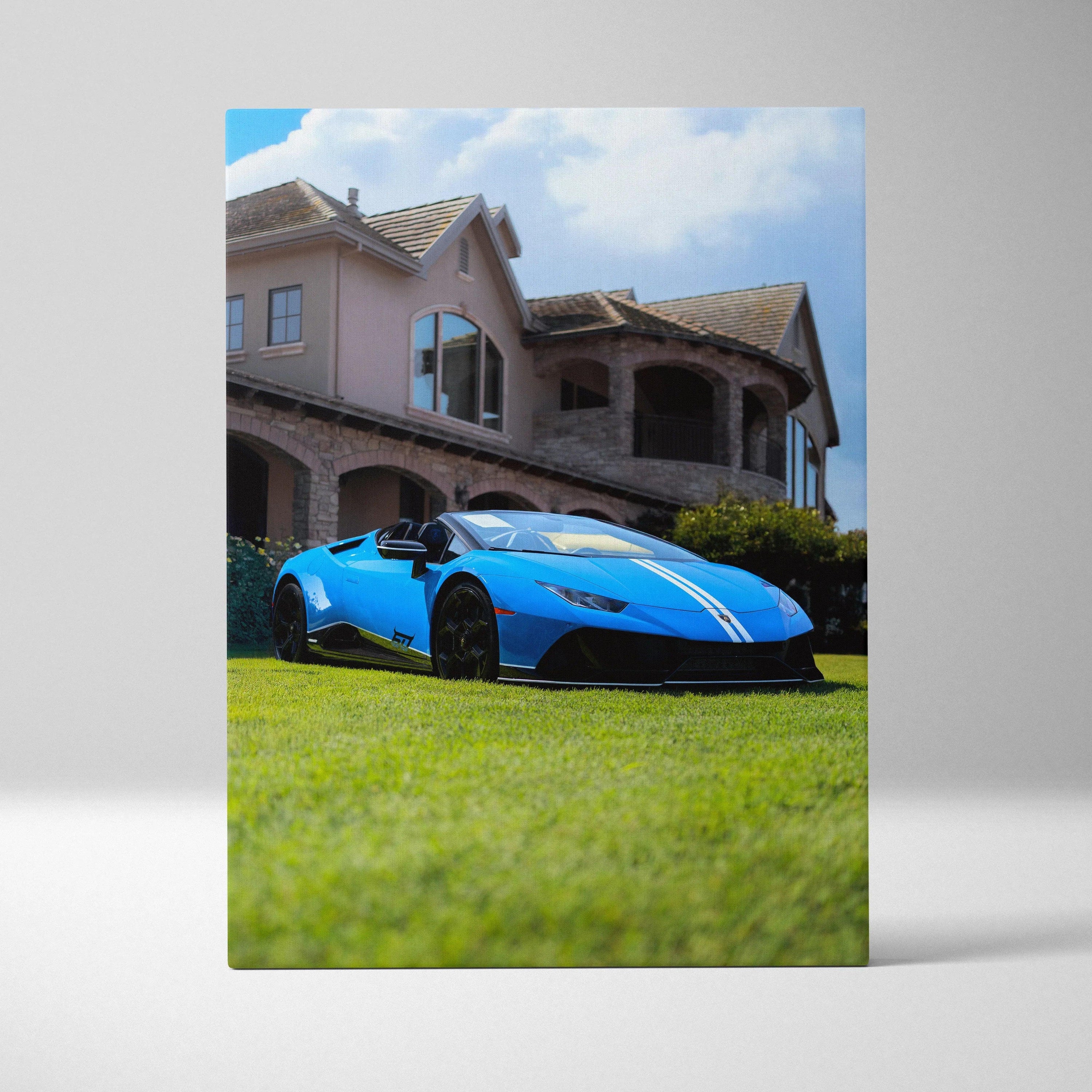 Blue Lamborghini Huracan parked on grass in front of luxury house vertical canvas art.