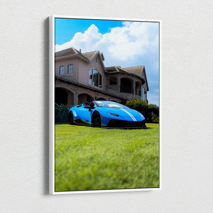 Blue Lamborghini Huracan on grass in front of luxury house vertical canvas wall art.