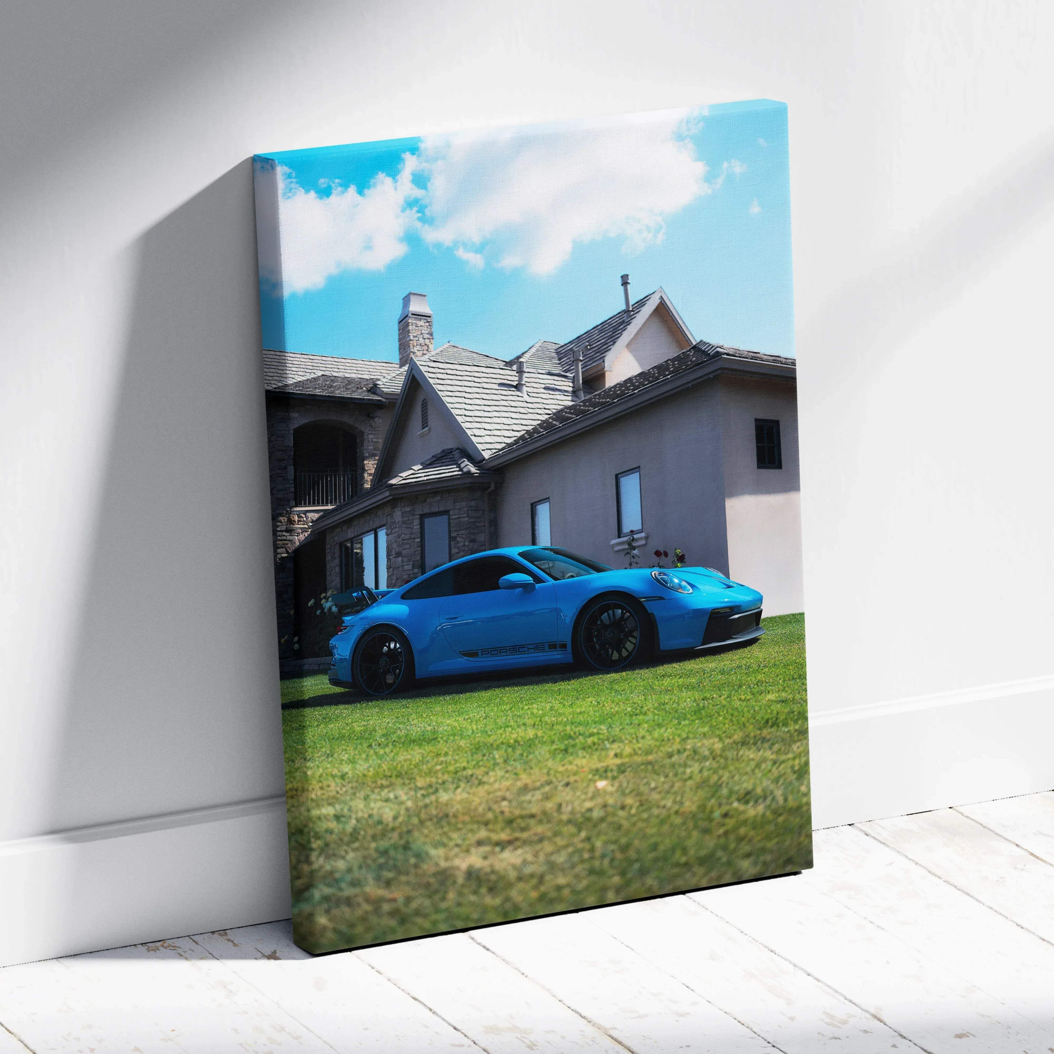 Canvas wall art featuring a vibrant blue porsche 911 gt3 sports car parked on grass in front of a stone house