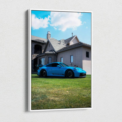Porsche 911 GT3 blue sports car on green lawn with house background vertical canvas wall art.