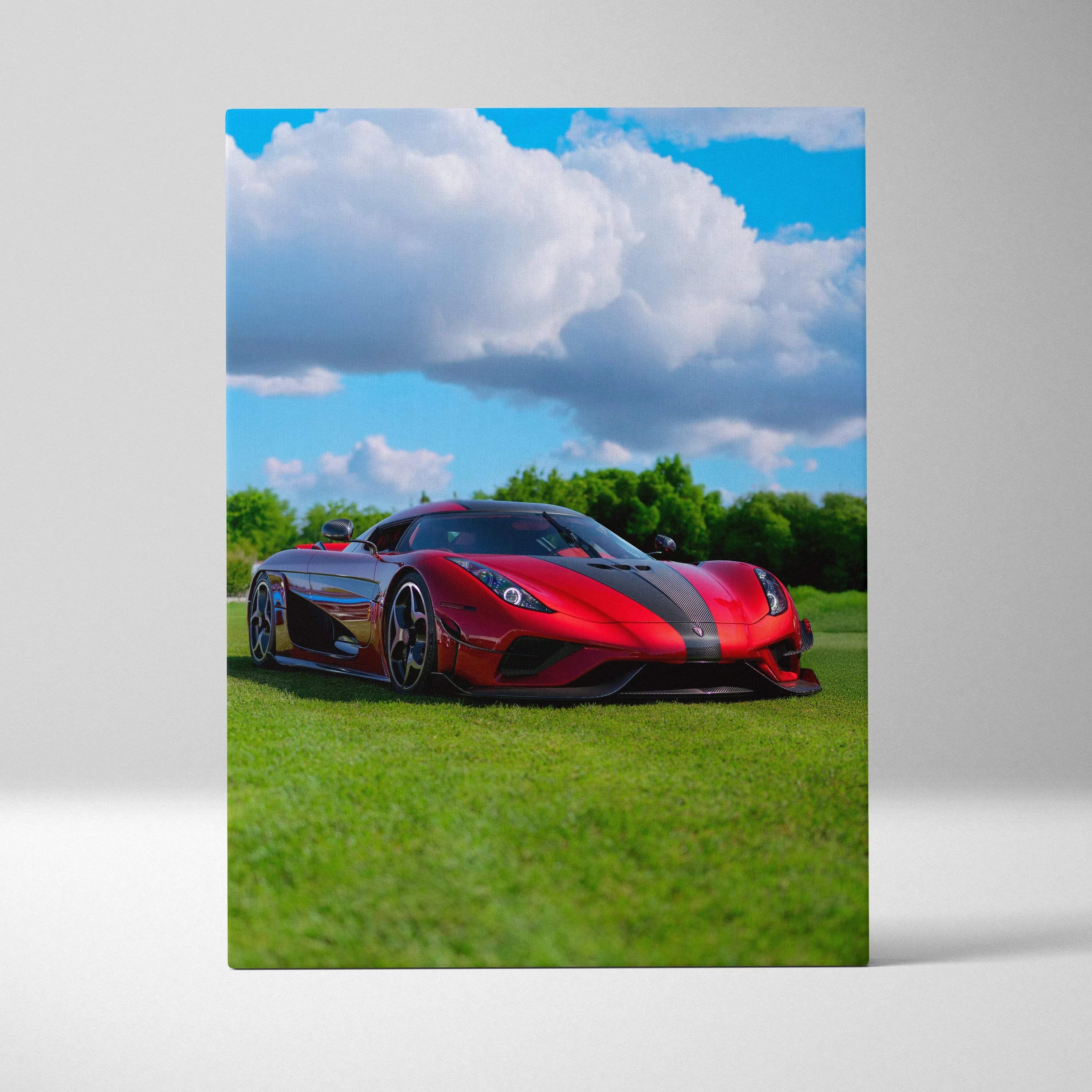 Vertical canvas art of a red Koenigsegg Regera sports car on green grass under a blue sky wall art.