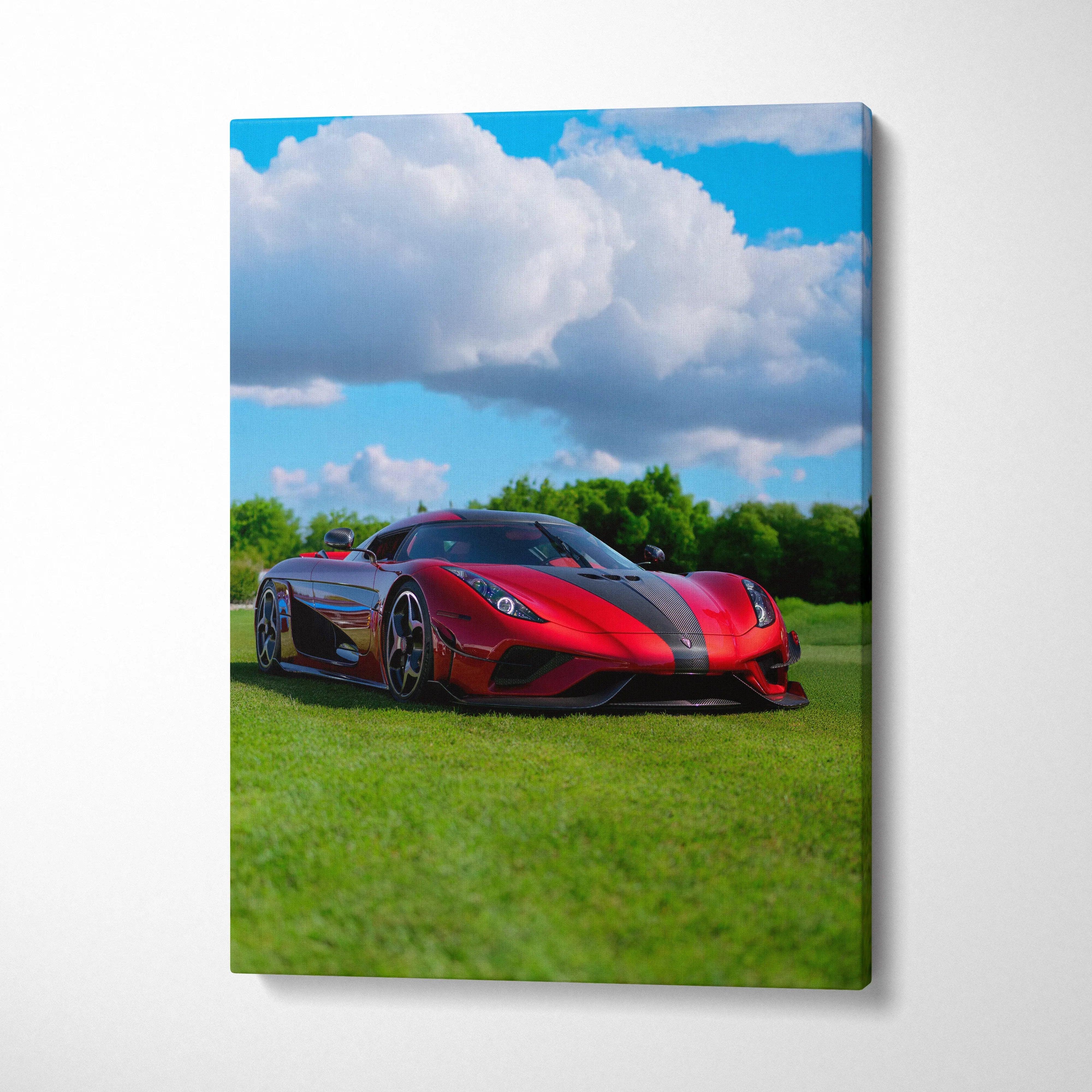 Vertical canvas wall art featuring a red Koenigsegg Regera sports car on green grass under a blue sky with clouds.