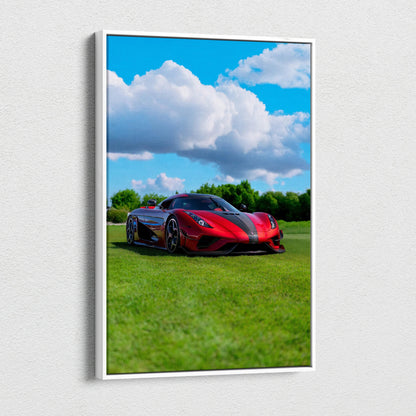 Vertical canvas wall art featuring a red Koenigsegg Regera sports car on grass under a blue sky with clouds.