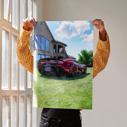 Koenigsegg Regera supercar poster wall art showing side and rear view on grass under blue sky.