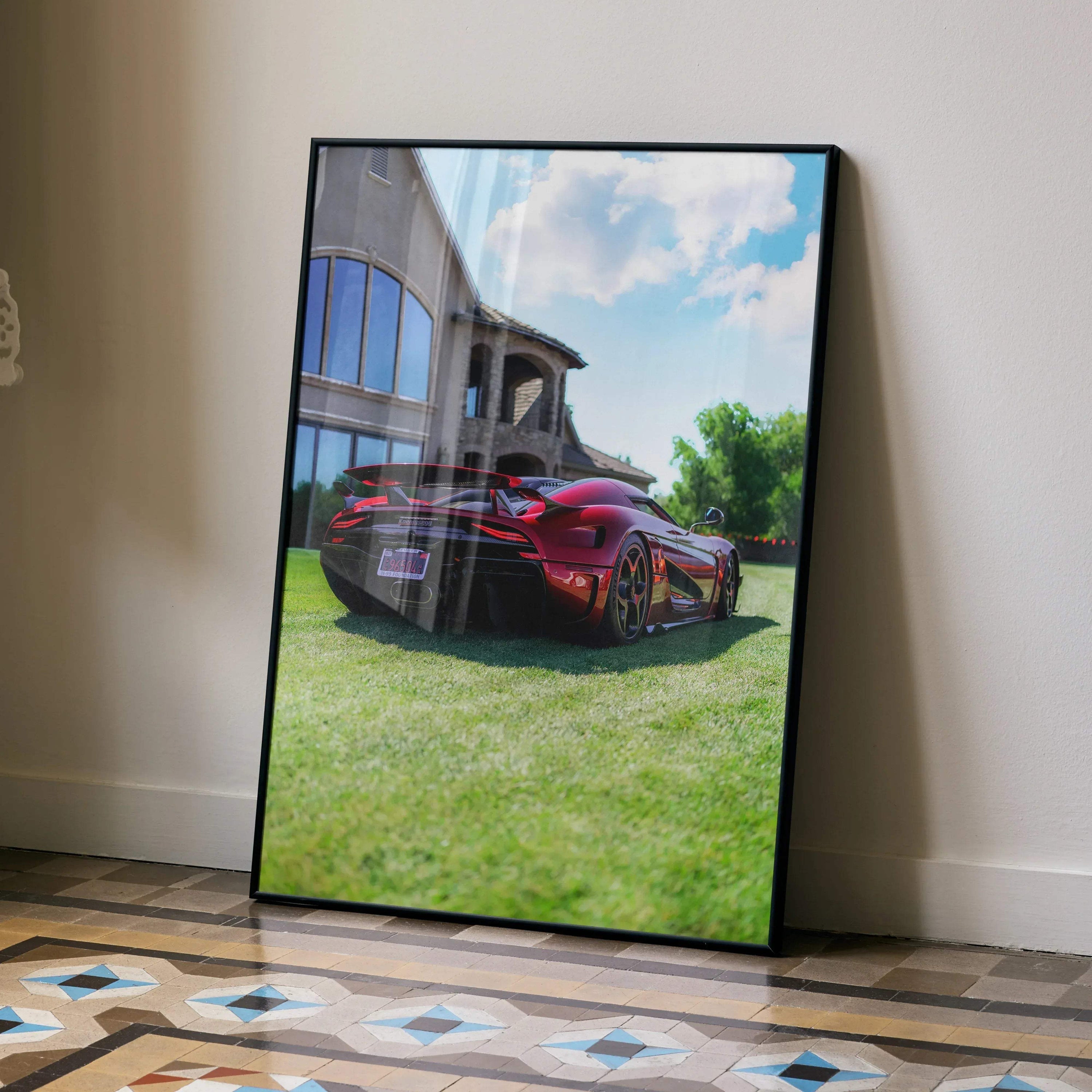 Koenigsegg Regera high-resolution wall art poster with vibrant red sports car and modern building backdrop.