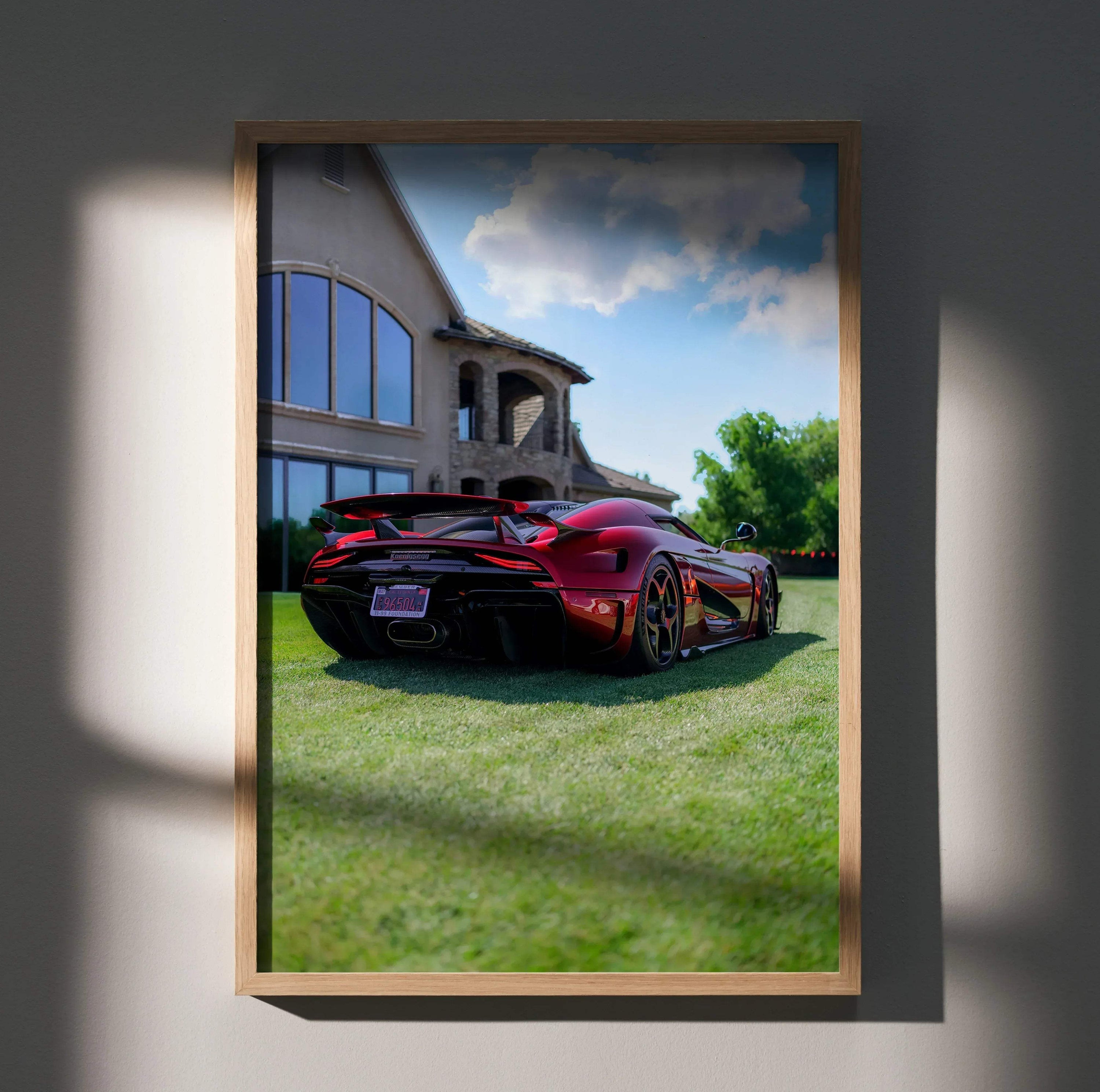 Koenigsegg Regera high-resolution poster featuring sleek red sports car parked on green grass wall art.