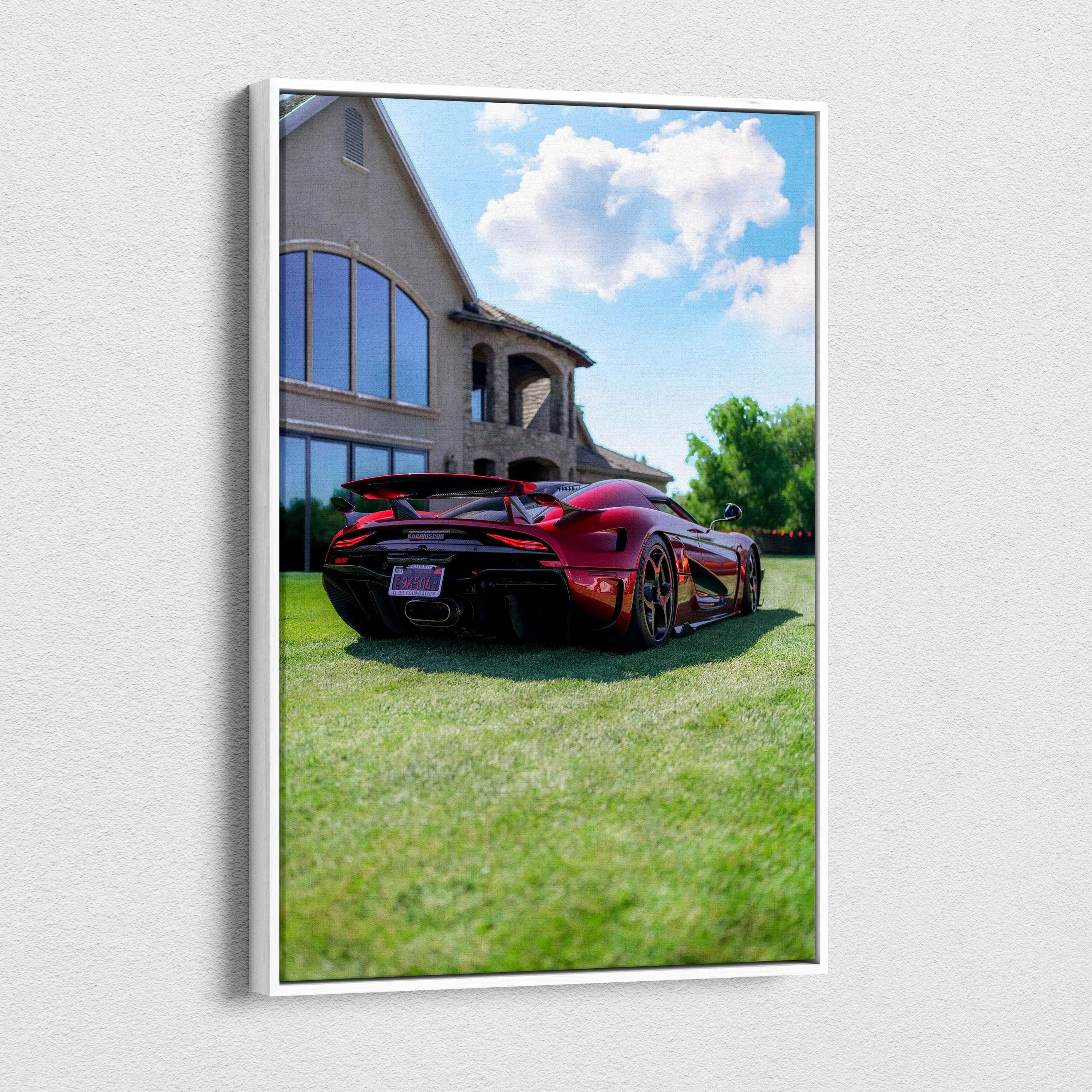 Koenigsegg Regera red sports car parked on grass near modern house canvas wall art.