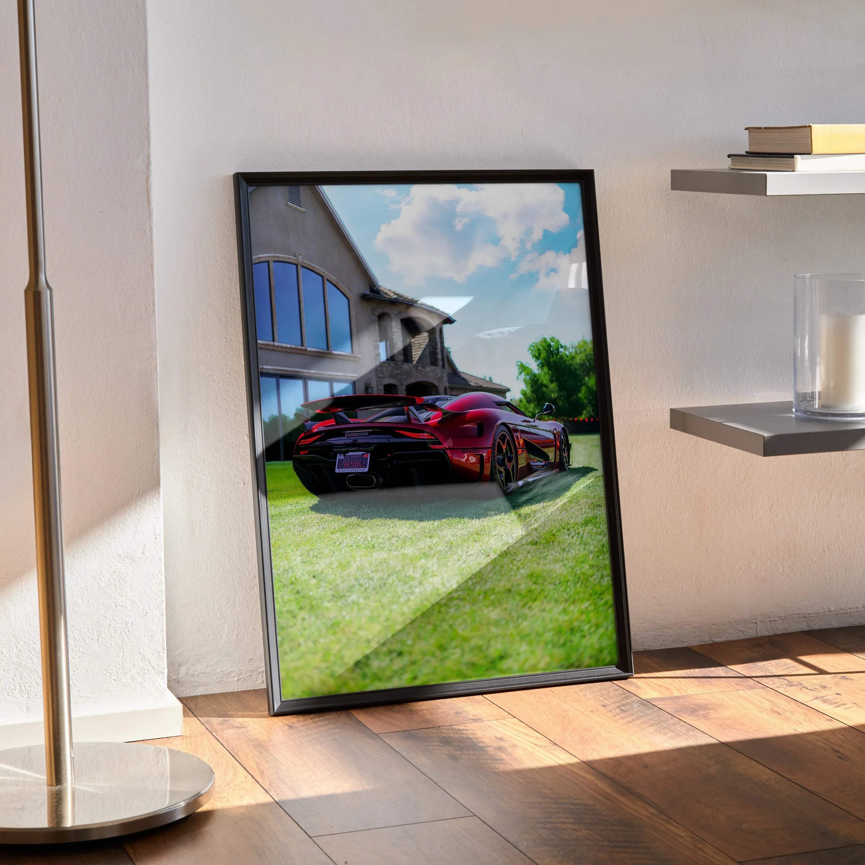 Koenigsegg Regera poster showcasing a red sports car parked by modern glass building, wall art in black frame.
