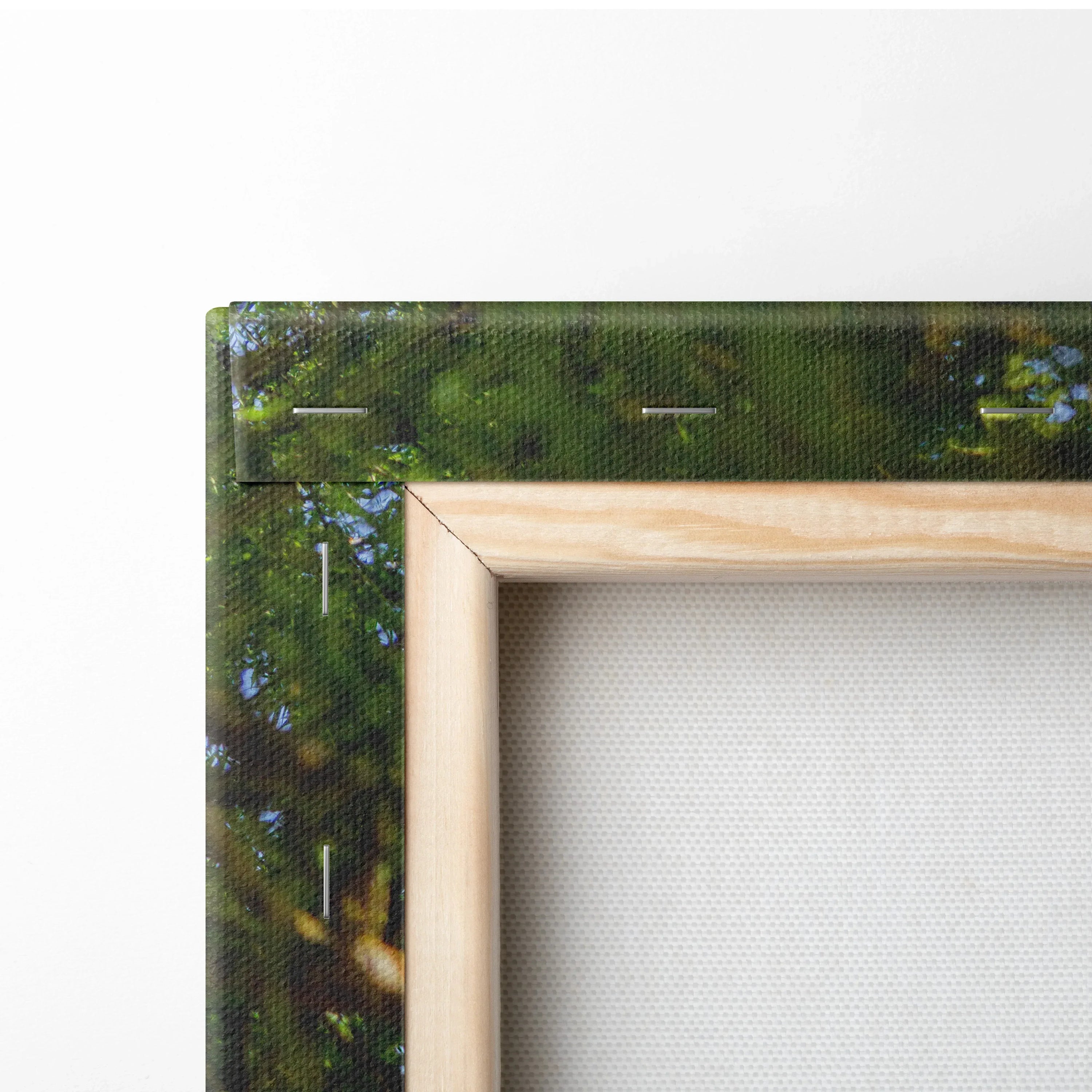 Close-up of wooden frame and stretched canvas showing texture and corner detail of high-quality canvas art wall decor.
