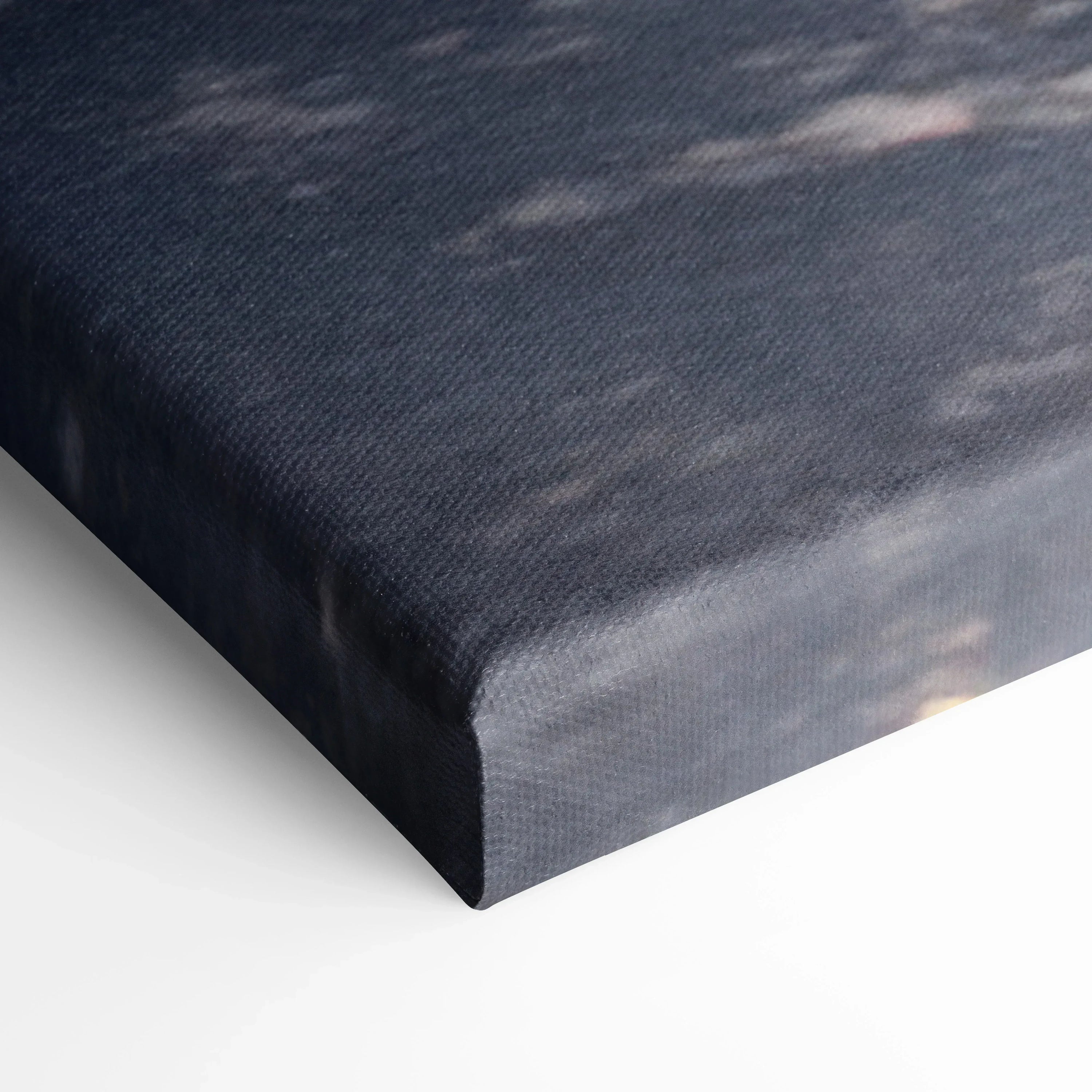 Close-up of textured canvas wall art showing dark gray and black tones with fine detail on the edge of the Lamborghini.