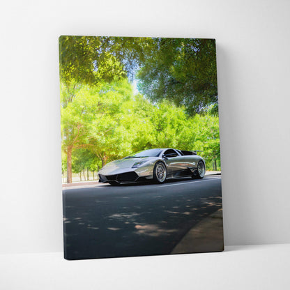 Lamborghini Murcielago sleek black sports car on road surrounded by trees canvas wall art.
