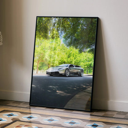 Lamborghini Murcielago poster showing silver sports car under green trees, sleek wall art design.