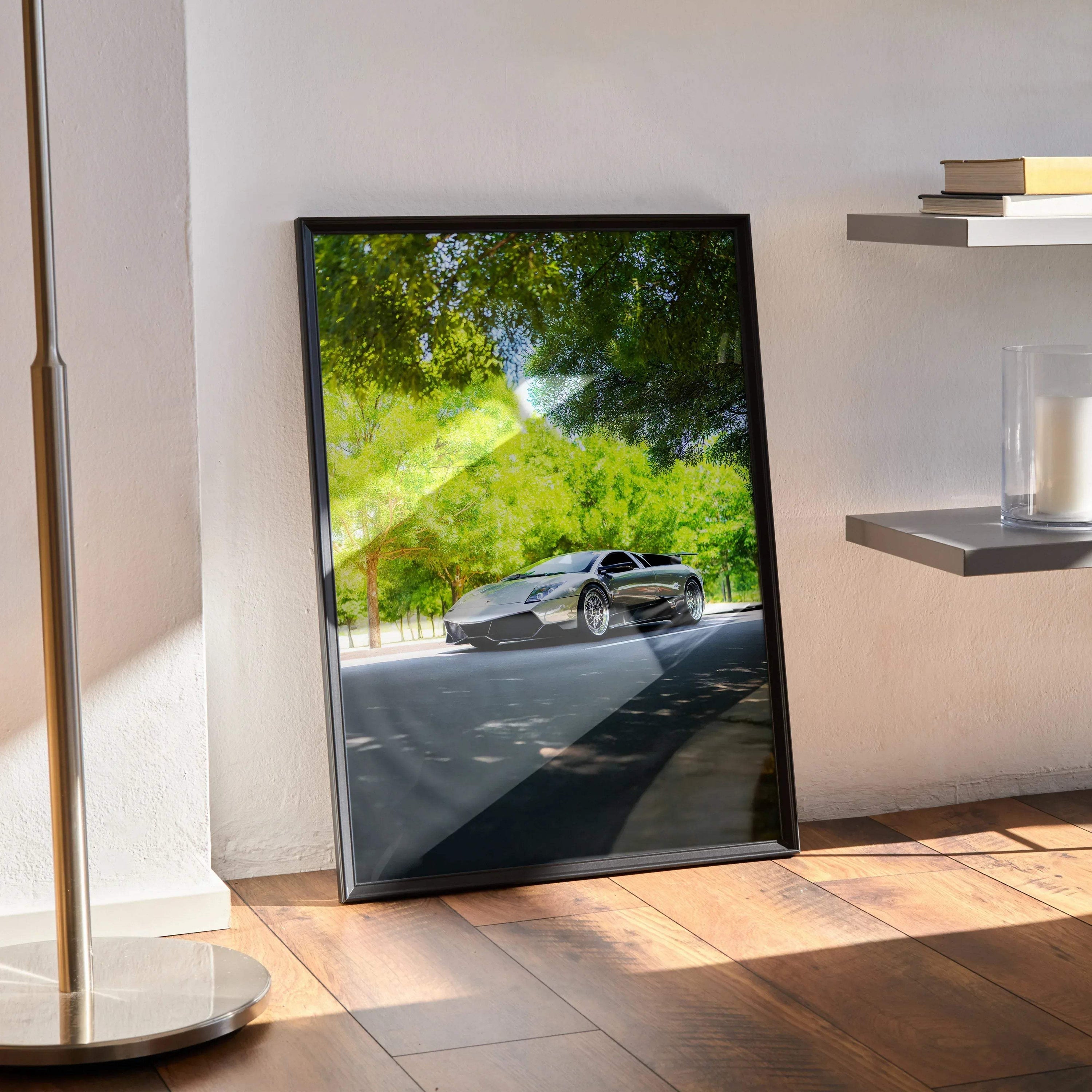 Lamborghini Murcielago poster in black frame leaning against wall with sunlit floor and shadow patterns wall art.
