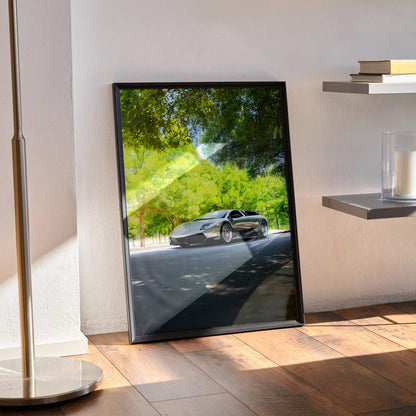 Lamborghini Murcielago poster in black frame leaning against wall with sunlit floor and shadow patterns wall art.