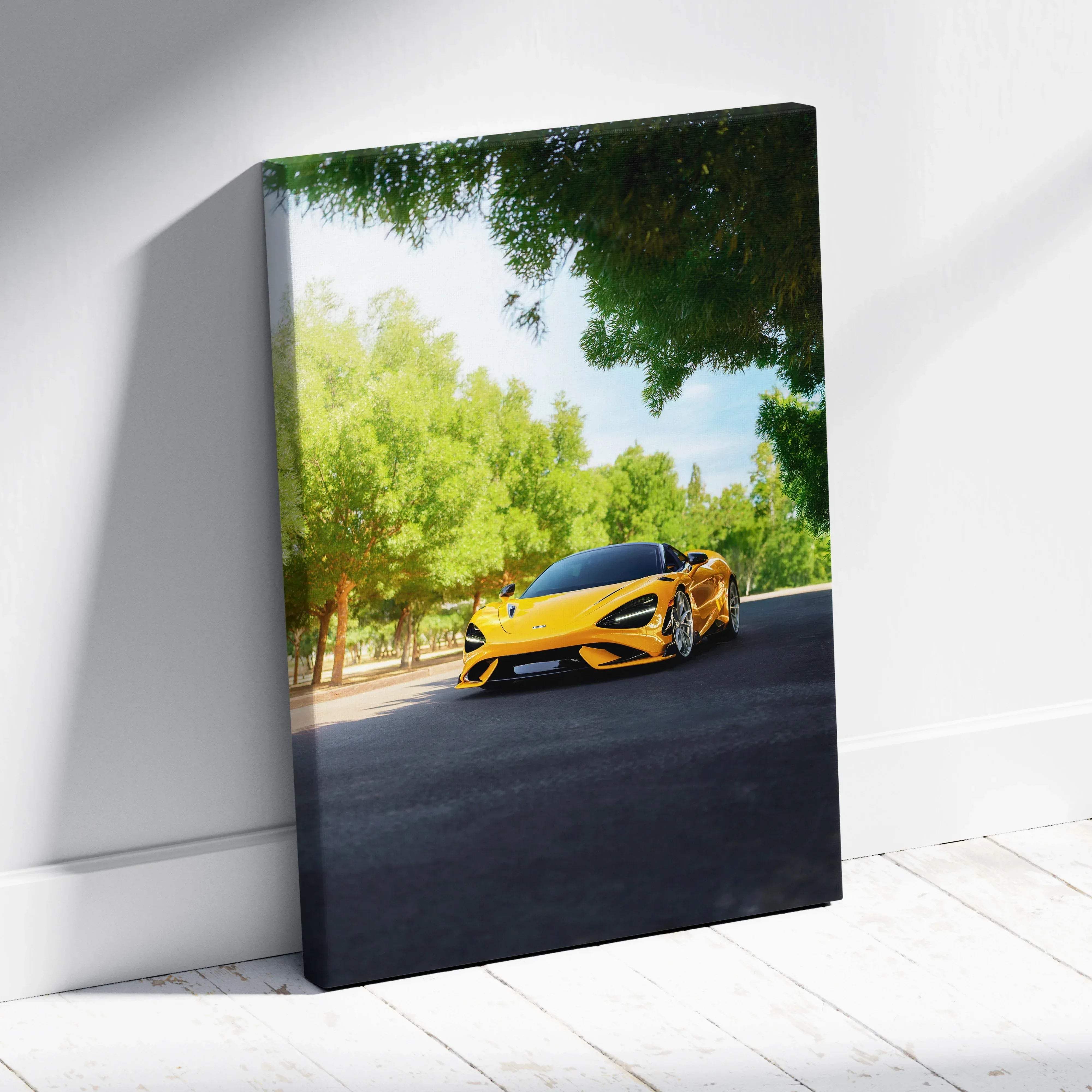 Canvas wall art featuring vibrant yellow mclaren 720s sports car print leaning against a white wall